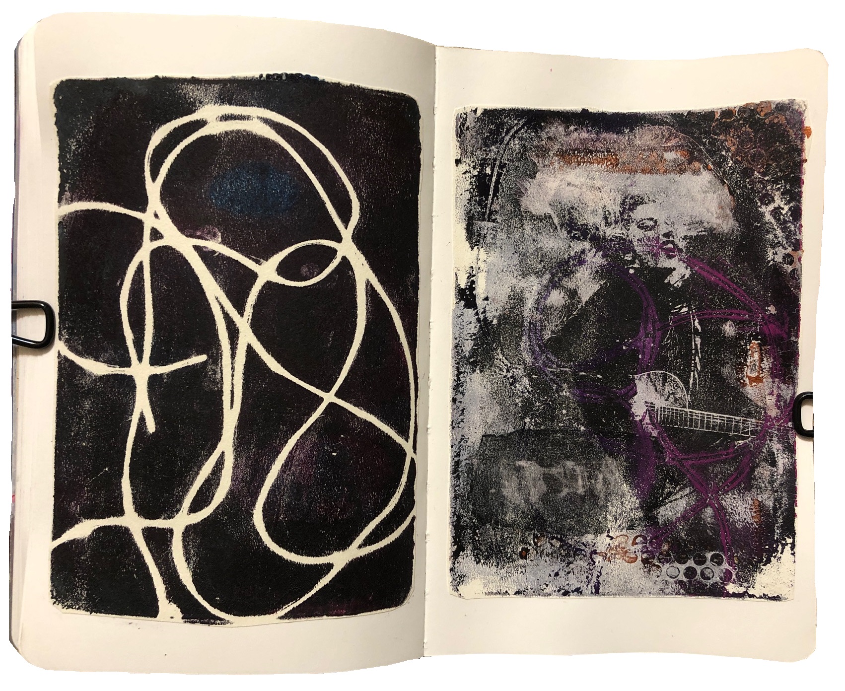 A mixed media art journal page with monoprinting experiments using a gel plate, I tried an image transfer of Lady Gaga on the right.