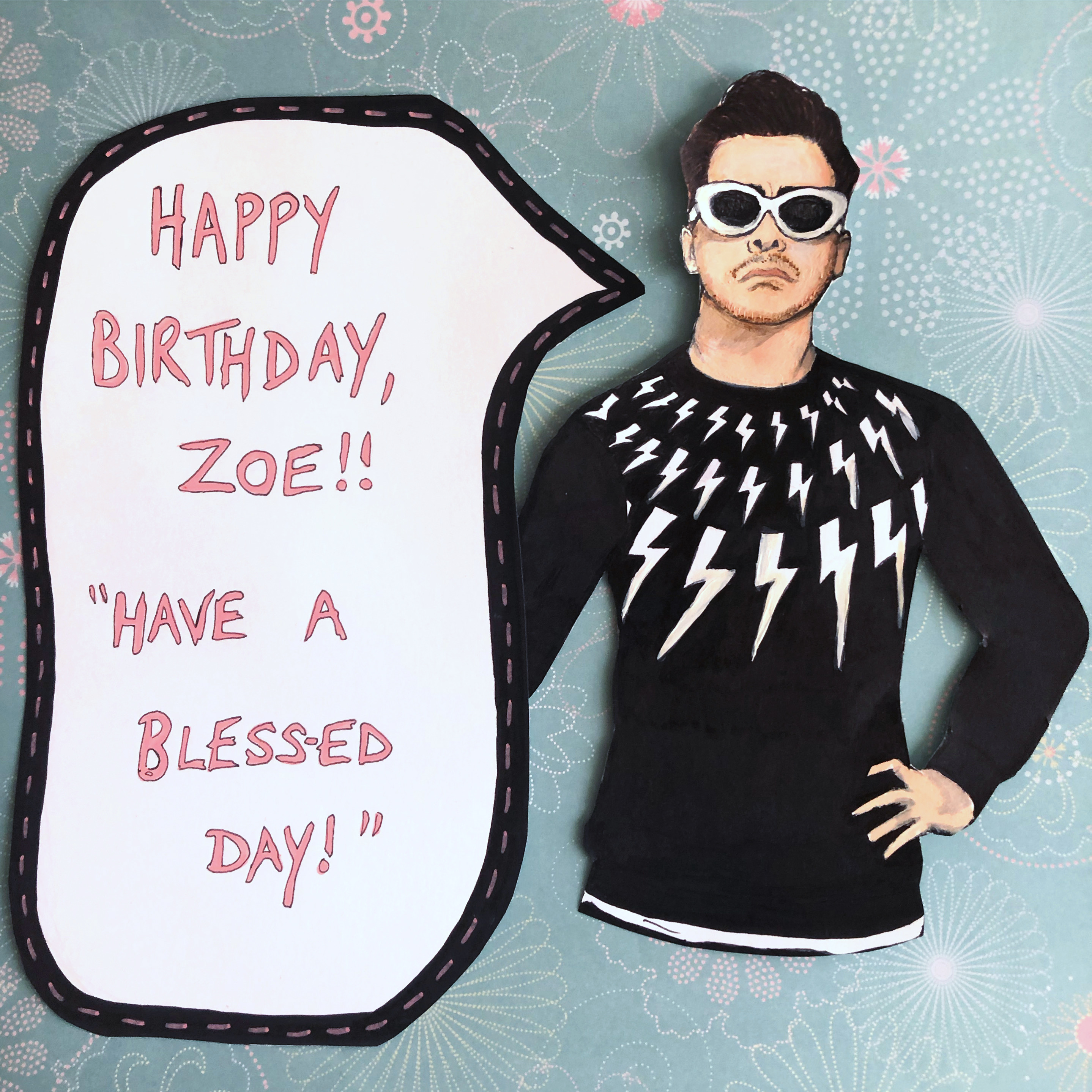 A birthday sign I made for a friend with a drawing of David Rose from the TV show Schitt's Creek saying have a bless-ed day!; the sign was created with a floral scrapbook insert, ink, and acrylic markers.