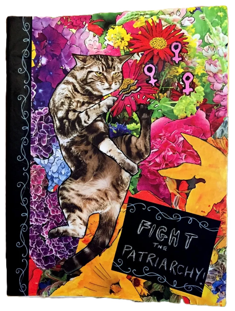 The front cover of a custom art journal I made for a friend with a collage of a cat doing martial arts in front of colorful flowers with the words fight the patriarchy written on washi tape; the cover was created with ink, washi tape, and collage material.
