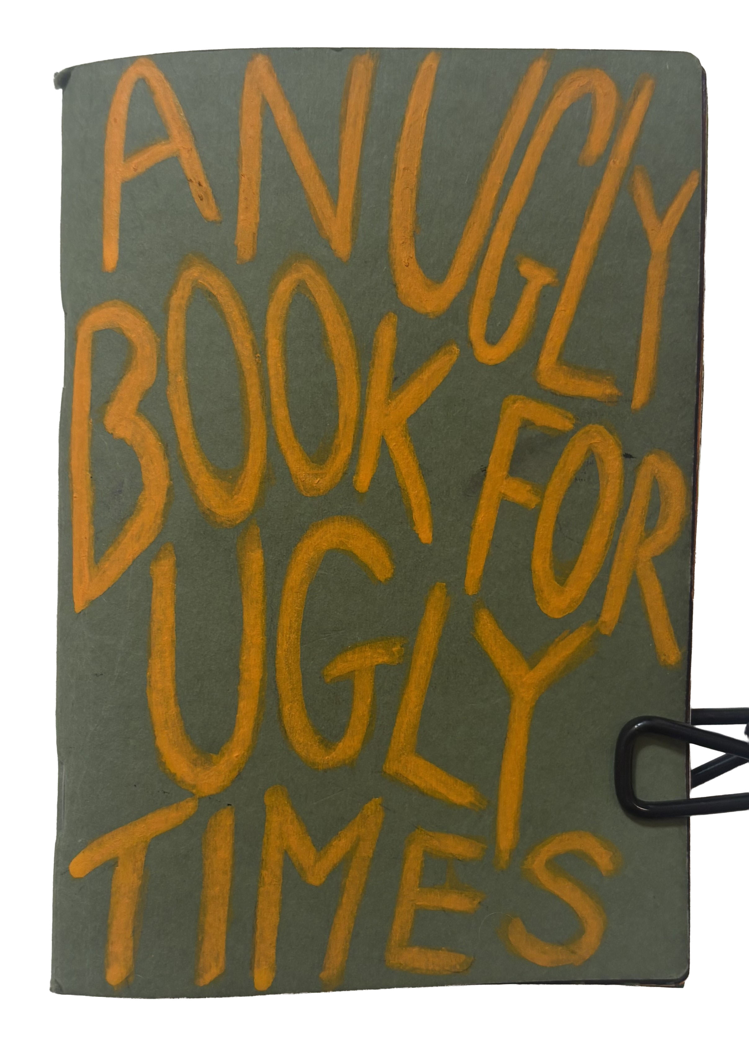 Art journal cover that says, An ugly book for ugly times.