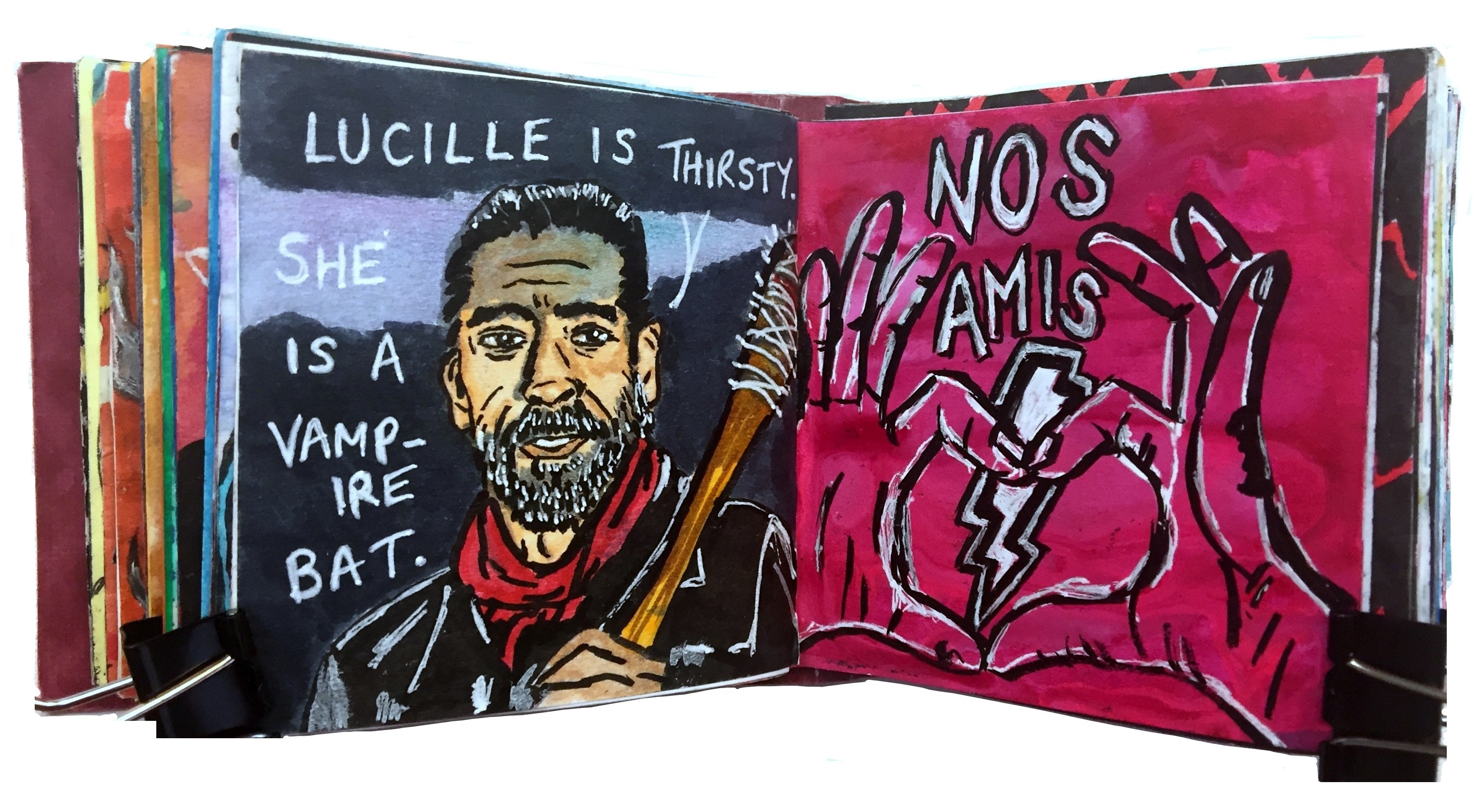 Days 43 and 44a/365 of Year of Creative Habits. A mixed media art journal illustration of Negan from The Walking Dead with the words Lucille is thirsty, she is a vampire bat and a drawing of hands making a heart in front of a lightning bolt with the words nos amis from an Eagles of Death Metal documentary.